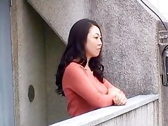 Japanese MILF's Public Self-Pleasure Ends with Explosive Orgasm on Balcony