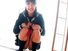 Jailbait schoolgirl shows off her perky booty in Tokyo XXX pose